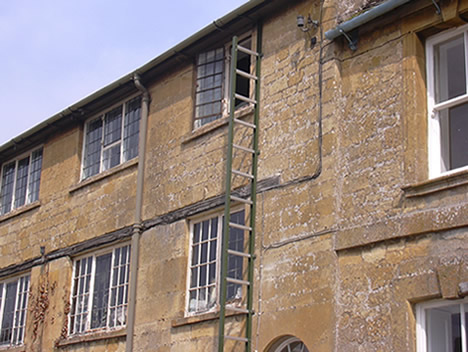 Foldout fire escape ladder fitted to older building