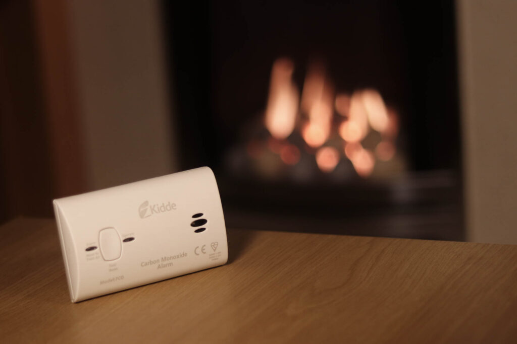 Kidde carbon monoxide alarm placed near a gas fire