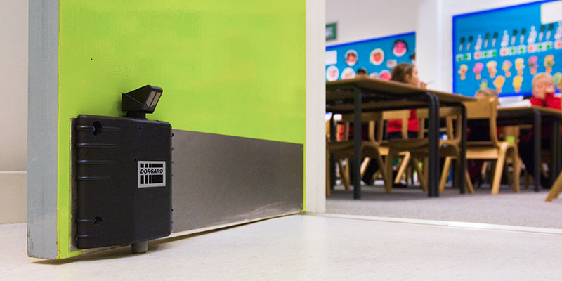 increase ventilation with a fire door retainer on classroom doors