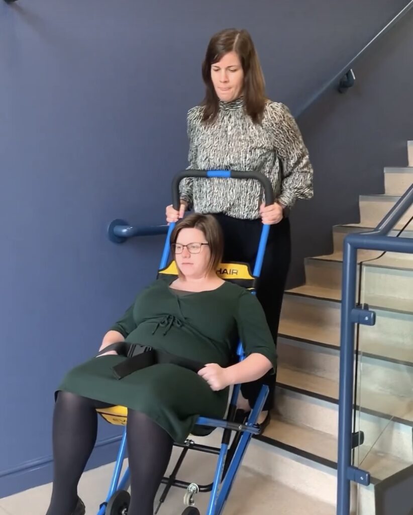 Evacuating a pregnant lady in an evacuation chair