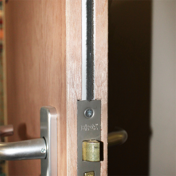 Intumescent strip fitted to fire door