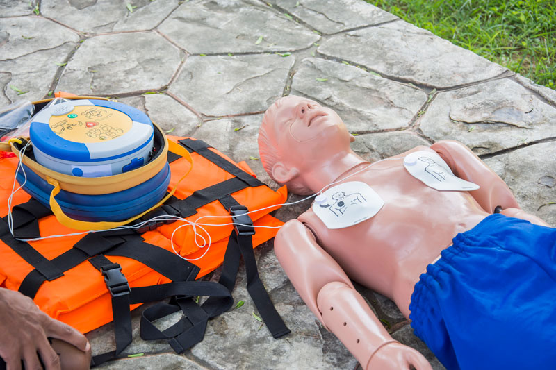 Defibrillator pads on a child manekin