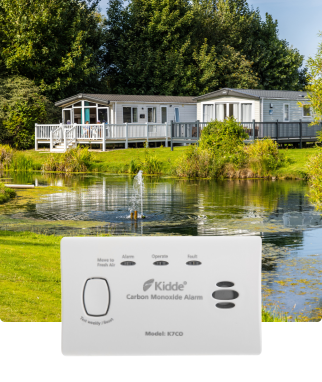 2 statis caravans over a tranquil lake on a sunny day