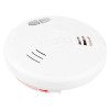 White circular smoke alarm with vented sides, central Kidde Fyrnetics branding, and a red arrow indicating the removal direction.