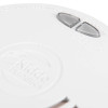 Close‑up of a Kidde smoke alarm featuring HUSH and TEST WEEKLY buttons, vented sensor area, and embossed safety instructions.