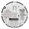 Back of a Kidde heat alarm showing battery compartment, PRESS TO REMOVE latch, printed safety instructions, and model details.