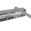 assa abloy dc140a door closer showing the back side with an alarm label and mounting hardware visible