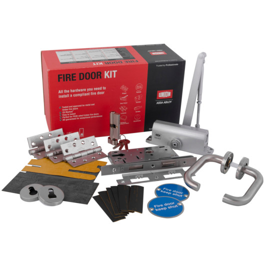 Assa Abloy sashlock fire door kit with lock components, door handles, hinges, keys, and signs arranged in a group
