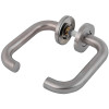 Metal handles from the assa abloy sashlock fire door kit shown detached and viewed from an angle