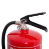 Closeup of the handle and pressure gauge on the act water mist extinguisher with a black lever and red tank
