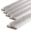 Close-up of a pack of white single fire and smoke seal strips showing soft fibres on one edge