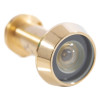 Close up of a brass fire rated door viewer showing the lens and metal casing