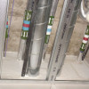 astroflame fire batt shown installed around several metal pipes in a utility area