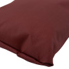 Close up of the end of an astro pillow large in a dark red textured fabric
