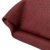 Close up corner of the small astro pillow showing textured fabric in a reddish colour