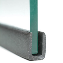 front view of intumescent glazing u channel holding a piece of glass against a white background