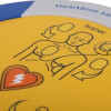 Close up of the front button and part of the design on the Heartsine Samaritan Pad 350P Trainer