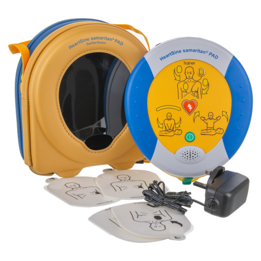 heartsine 500p trainer unit with case, charging cable and three electrode pads showing illustrated placement guidance