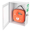 A white wall‑mounted cabinet with a transparent door containing an orange IPAD AED case with a heart and lightning bolt symbol and a small digital display. A green defibrillator sign is shown on the door.