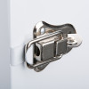 Close-up of a metal latch on a heartsine white internal cabinet showing the locking mechanism