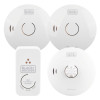 A set of four BLACK+DECKER fire safety devices, including two round smoke and one heat alarm and one rectangular control unit with labelled indicator lights and test/silence buttons.