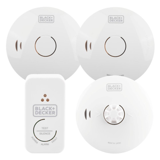 A set of four BLACK+DECKER fire safety devices, including two round smoke and one heat alarm and one rectangular control unit with labelled indicator lights and test/silence buttons.
