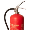 close up of the top part of a p50 fluorine free b foam extinguisher showing the handle, gauge, and hose connection