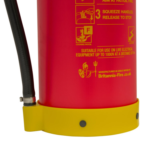 Close-up of the nozzle on a p50 wet chemical fire extinguisher with part of the red body and yellow base visible