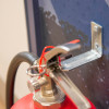 britannia p50 fire extinguisher wall bracket mounted on a wall holding a fire extinguisher in place