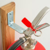 britannia p50 fire extinguisher wall bracket mounted on wooden wall with part of extinguisher and tag visible