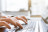 hand typing a blog on a laptop keyboard
