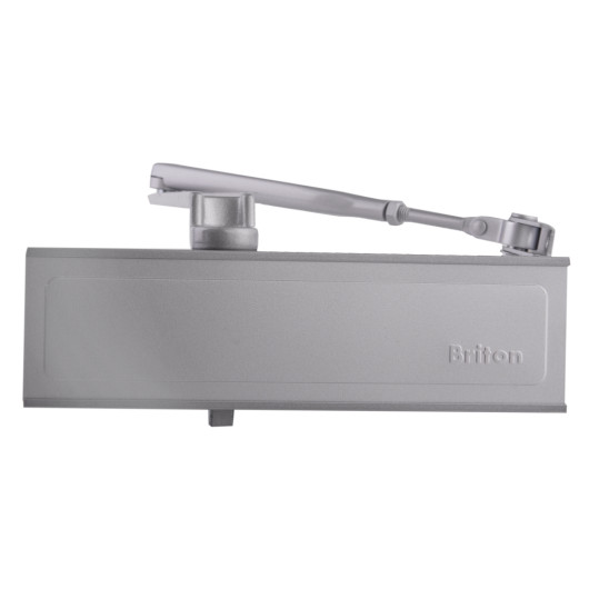 Front view of a silver Briton 1110 overhead door closer showing the arm and main body with the Briton logo