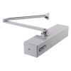 Silver Briton 2003 overhead door closer shown from an angled view with arm extended and visible label