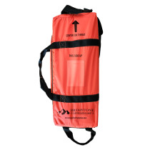 brimstone ev blanket bag in bright red with black handles and text against a white background