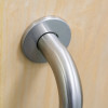 Close-up of the briton 4700 pull handle roses 22mm attached to a wooden door