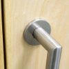 Close up of the mitred on door showing the Briton 4700 rose kit 22mm in brushed metal finish