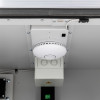 Close up of small basic cemo lockex showing a round white alarm device attached to a ceiling panel