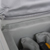 Close-up of the soft grey lining inside the battery fire protection box showing padded fabric layers