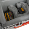Grey protective pads inside a battery fire protection box cushioning two batteries