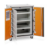 An open metal cabinet with orange doors, internal shelves, a bottom ventilation fan, and a printed instruction sheet on the left door.