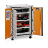 Metal cabinet with orange doors open, showing shelves of STIHL and other power‑tool chargers neatly arranged