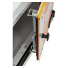Close‑up of an adjustable hinge mechanism mounted on an orange panel, showing screws, springs, and a black tightening knob