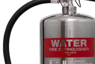 A chrome water fire extinguisher with a red label