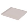 angled view of single shelf from first aid cabinet in plain light colour with raised edges
