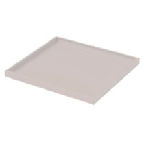 angled view of single shelf from first aid cabinet in plain light colour with raised edges