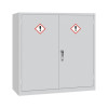 A large light grey double‑door COSHH storage cabinet featuring two red‑bordered exclamation hazard symbols on the doors and a central silver handle.