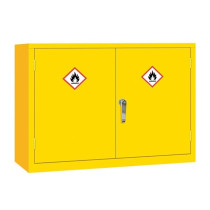 A shorter, wide yellow double‑door flammable liquid storage cabinet featuring two flame hazard labels on the doors and a central silver handle.
