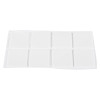 Sheet of white square adhesive pads arranged in two rows