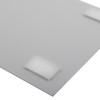 Close up of a self adhesive wall mounting kit attached to the back of a white identification sign