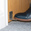 Foot pressing stainless steel foot operated door opener decamed attached to wooden door bottom edge